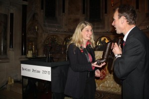 Winner, Clare Sambrook receives her award from Andrew Marr